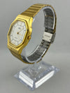 Quarzo dorato retro Q&Q con bracciale